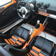 Illustration for article titled For $29,999, Could This Orange And Black 2005 Lotus Elise Have You Ready For Halloween?